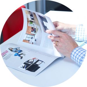 Managed Print Services Flipping through Konica Minolta brochure
